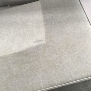 cleaning spilled stains from grey couch